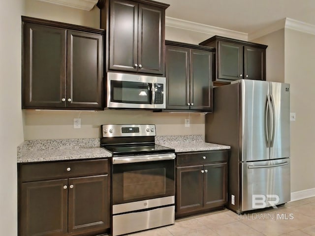 kitchen featuring crown molding, dark brown cabinets, and appliances with stainless steel finishes