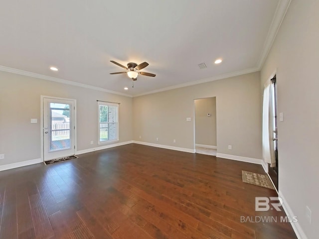 spare room featuring ceiling fan, ornamental molding, and dark hardwood / wood-style flooring