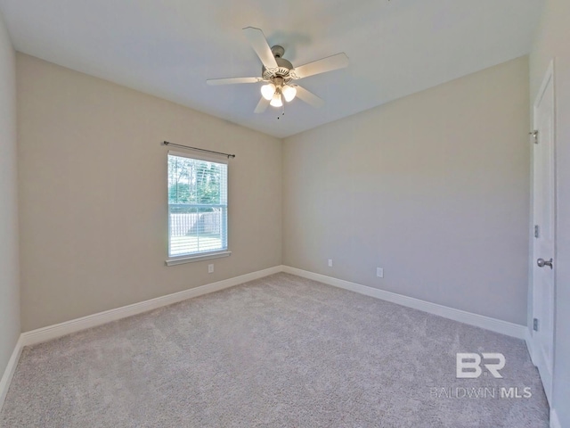 unfurnished room featuring ceiling fan and light colored carpet