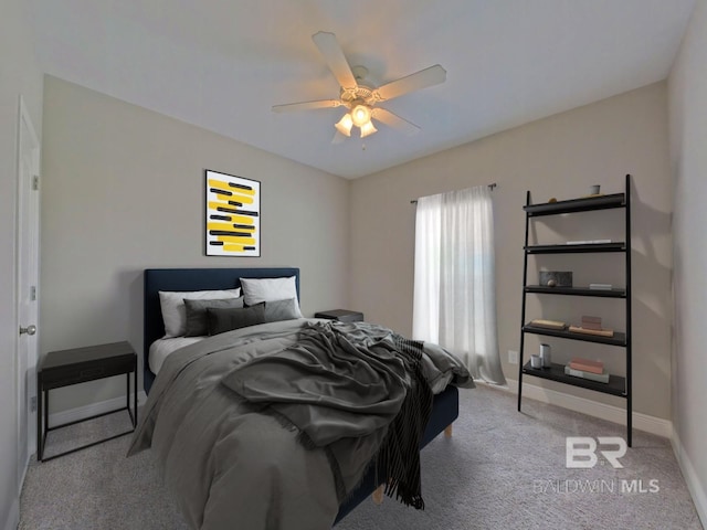 bedroom featuring light carpet and ceiling fan