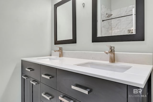 full bathroom featuring double vanity and a sink