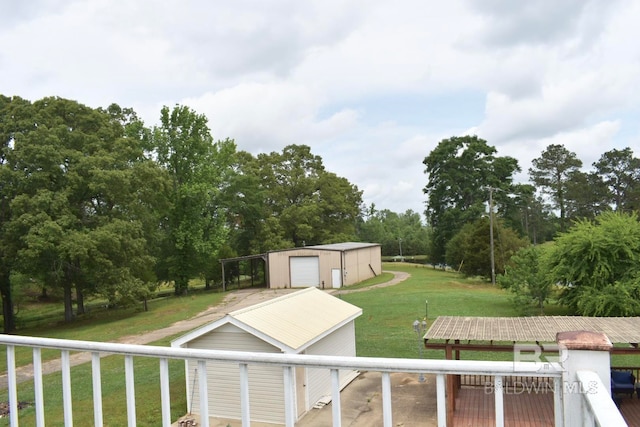 view of yard with a storage shed and a garage