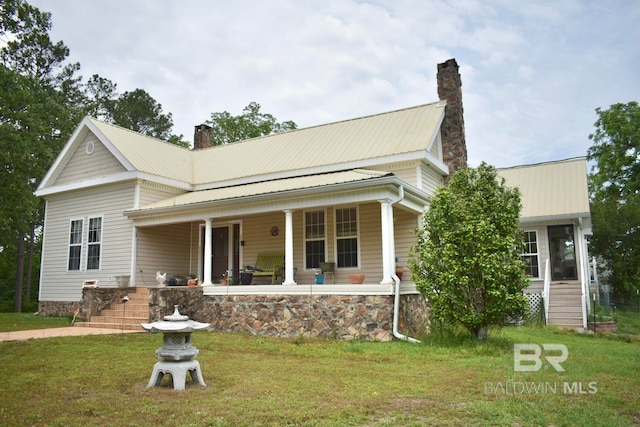 view of front of home featuring covered porch and a front yard