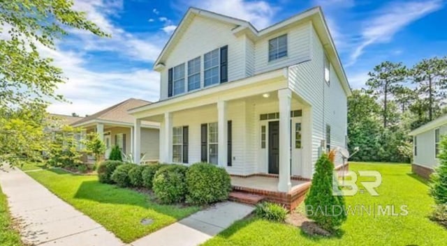 view of front of house featuring a front lawn and a porch