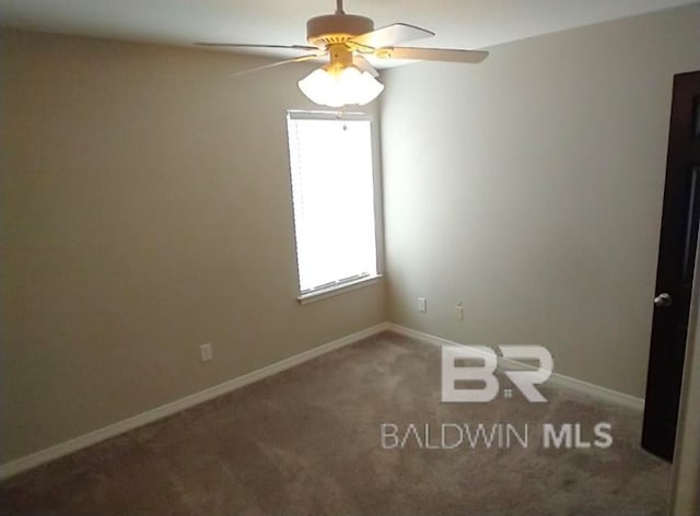 carpeted empty room with ceiling fan