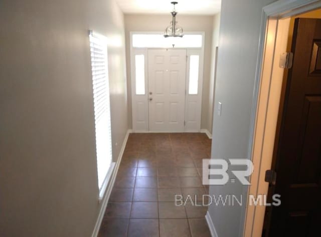 foyer with tile patterned floors