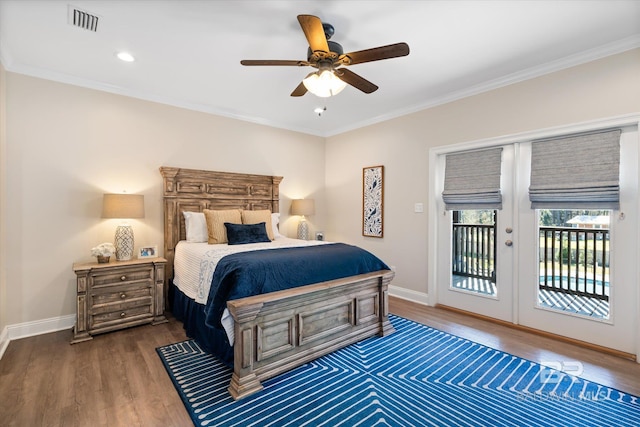 bedroom with access to exterior, crown molding, baseboards, and wood finished floors