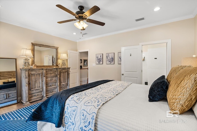 bedroom with ceiling fan, recessed lighting, wood finished floors, visible vents, and crown molding