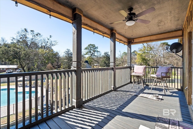 wooden terrace featuring ceiling fan