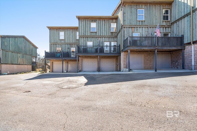 rear view of property with a garage