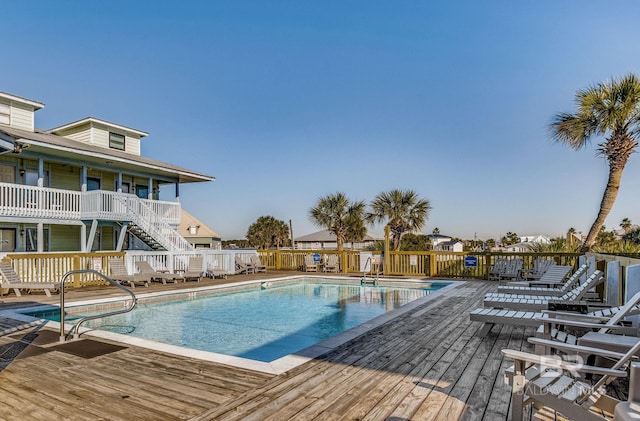 view of swimming pool with a wooden deck