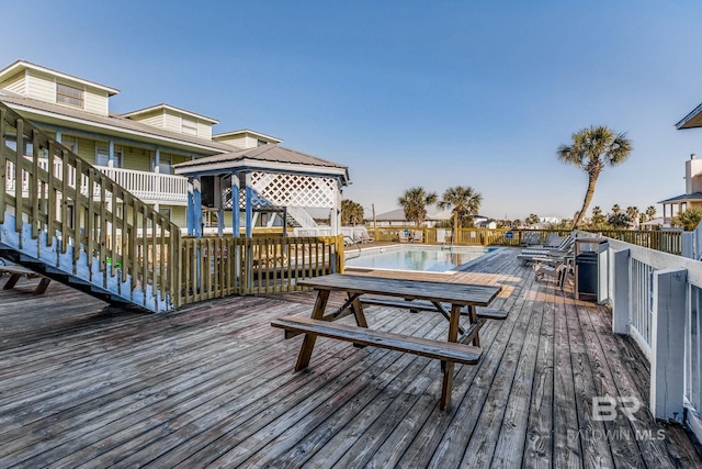 wooden deck featuring a gazebo