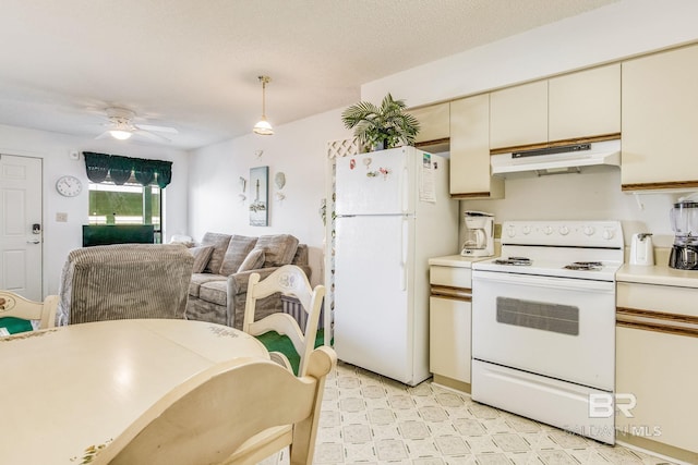 kitchen with white appliances, a textured ceiling, hanging light fixtures, cream cabinets, and ceiling fan