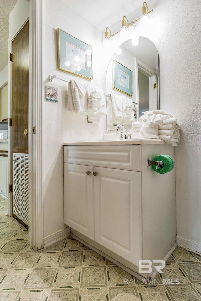 bathroom with vanity and radiator heating unit