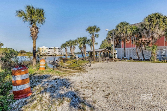 view of yard with a gazebo and a water view