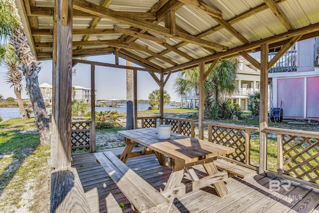 wooden deck featuring a water view