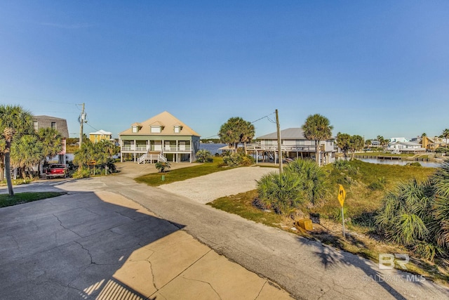 view of front of house with a water view