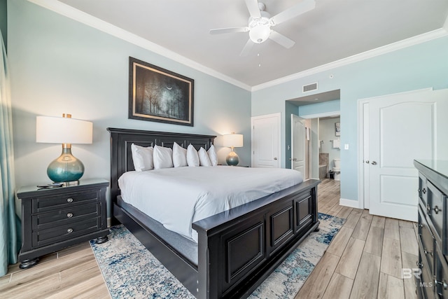 bedroom featuring crown molding, visible vents, wood tiled floor, connected bathroom, and baseboards