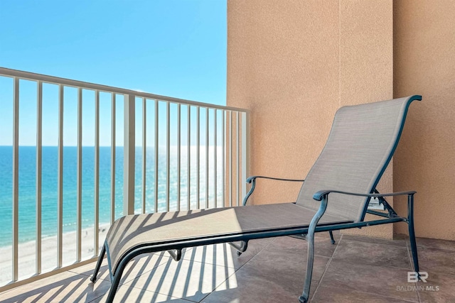 balcony with a beach view and a water view