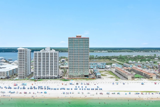 bird's eye view featuring a view of the beach, a water view, and a view of city