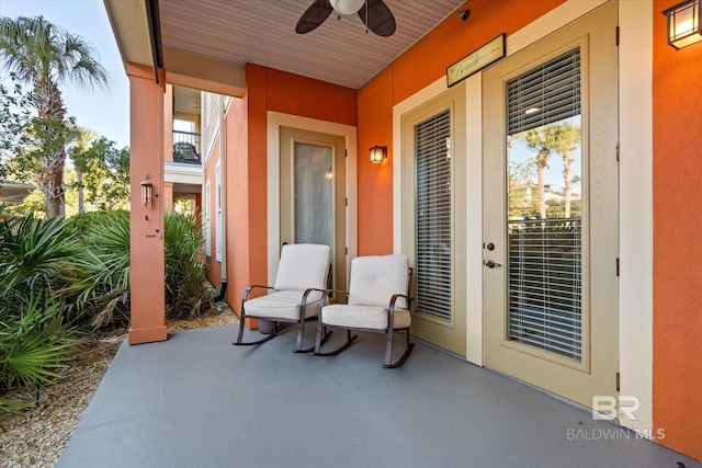 property entrance featuring ceiling fan and a patio area