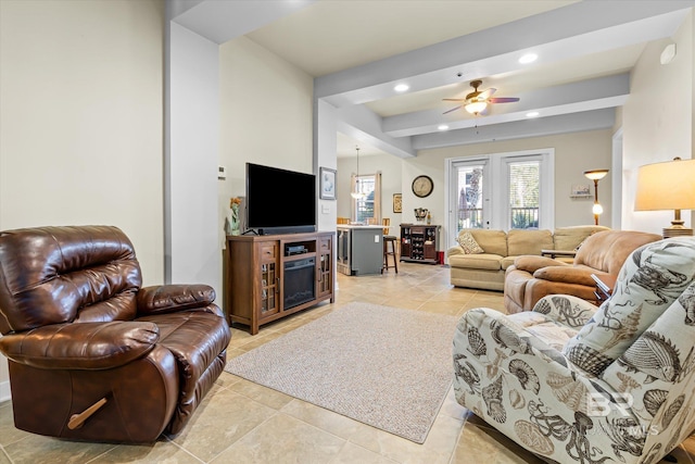 living room featuring ceiling fan and light tile patterned flooring