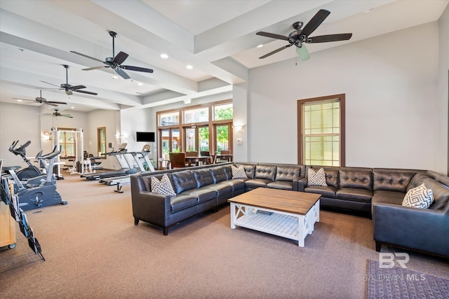 living room with carpet flooring and beam ceiling