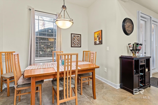 dining room with tile patterned flooring