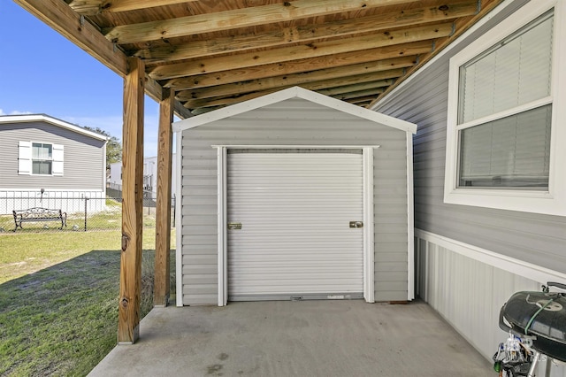 exterior space featuring a shed and fence