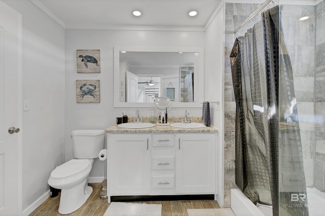 full bathroom featuring a shower, a sink, toilet, and ornamental molding