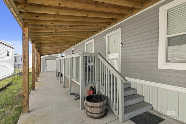 exterior space featuring an outbuilding and a shed