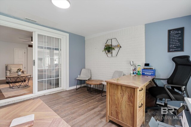 office space with ceiling fan and hardwood / wood-style flooring