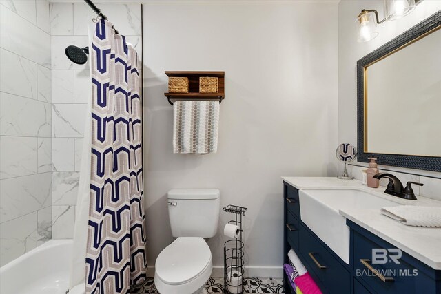 full bathroom featuring vanity, shower / tub combo, and toilet