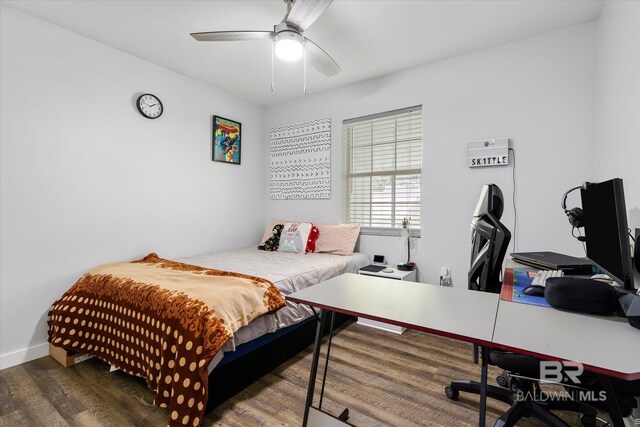 bedroom featuring ceiling fan and dark hardwood / wood-style floors