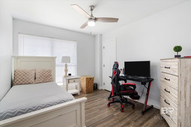 bedroom featuring ceiling fan and dark hardwood / wood-style floors