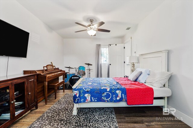 bedroom with wood-type flooring and ceiling fan