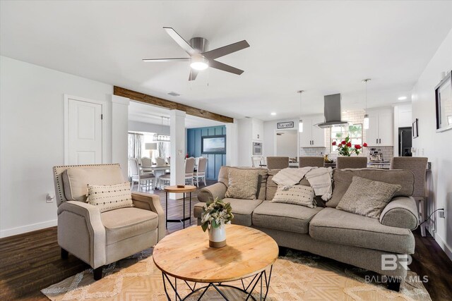 living room with a healthy amount of sunlight, light hardwood / wood-style floors, and ceiling fan