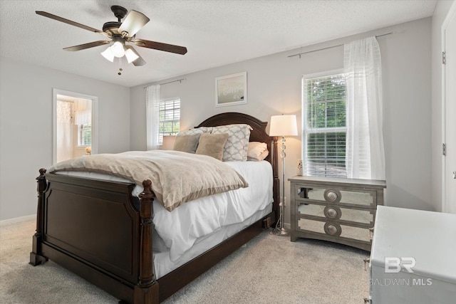 1116 Linlen Ave, Mobile, AL 36609 - bedroom featuring light carpet, multiple windows, a textured ceiling, and a ceiling fan
