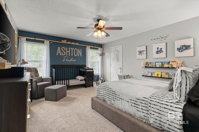 1116 Linlen Ave, Mobile, AL 36609 - carpeted bedroom with multiple windows, a ceiling fan, and a textured ceiling
