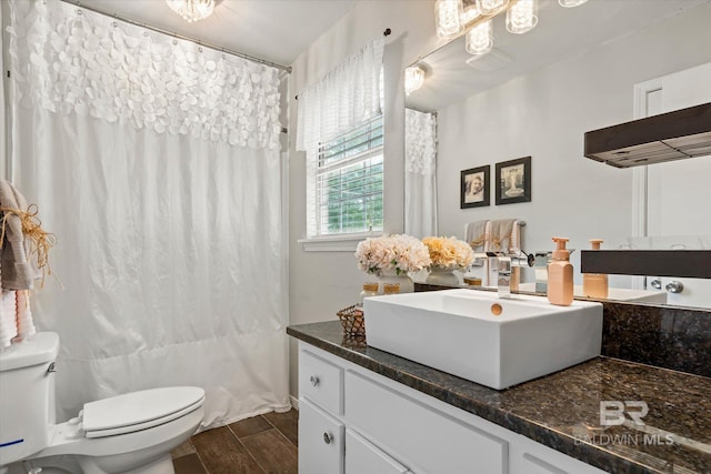 1116 Linlen Ave, Mobile, AL 36609 - full bathroom featuring toilet, vanity, wood finished floors, and a shower with shower curtain