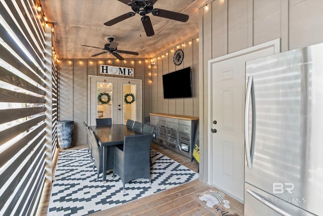 1116 Linlen Ave, Mobile, AL 36609 - dining room with hardwood / wood-style floors, wood walls, french doors, and ceiling fan