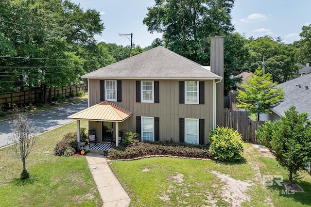 1116 Linlen Ave, Mobile, AL 36609 - view of front of house featuring a chimney, roof with shingles, and covered porch