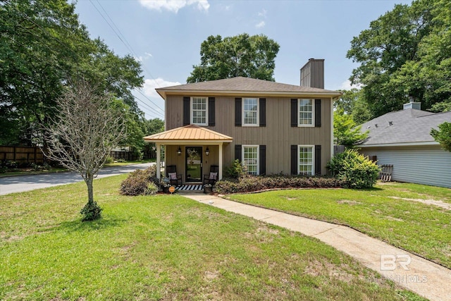 1116 Linlen Ave, Mobile, AL 36609 - view of front facade with a chimney and a front yard