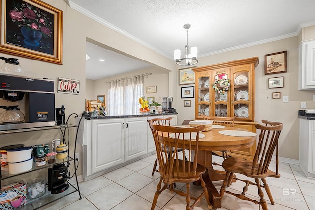 dining space with light tile patterned floors, an inviting chandelier, and ornamental molding