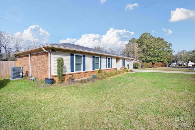 single story home with a front lawn, central air condition unit, fence, and brick siding