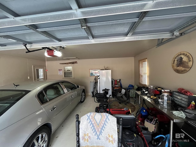 garage featuring a workshop area and a garage door opener