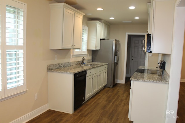 kitchen featuring recessed lighting, baseboards, white cabinets, appliances with stainless steel finishes, and dark wood finished floors