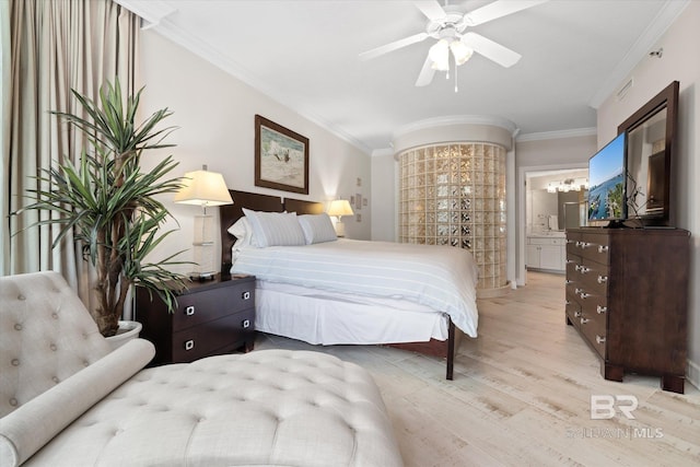 bedroom featuring ornamental molding, light wood-type flooring, connected bathroom, and a ceiling fan