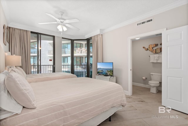 bedroom with visible vents, baseboards, access to outside, ornamental molding, and ensuite bath