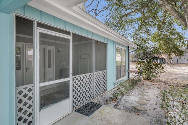 view of side of property with a sunroom